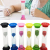 A set of six colorful hourglass sand timers in various colors and sizes displayed on a white surface.