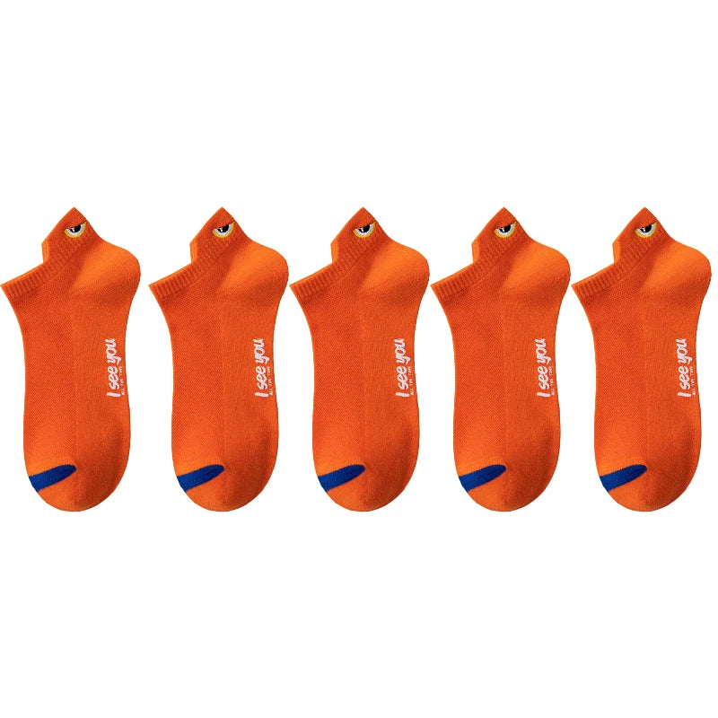 A set of orange men's breathable ankle boat socks displayed side by side.