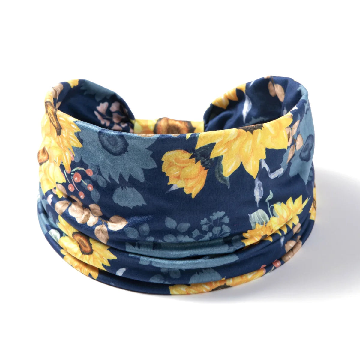 A navy blue floral butterfly headband is shown rolled up, featuring yellow and green accents.
