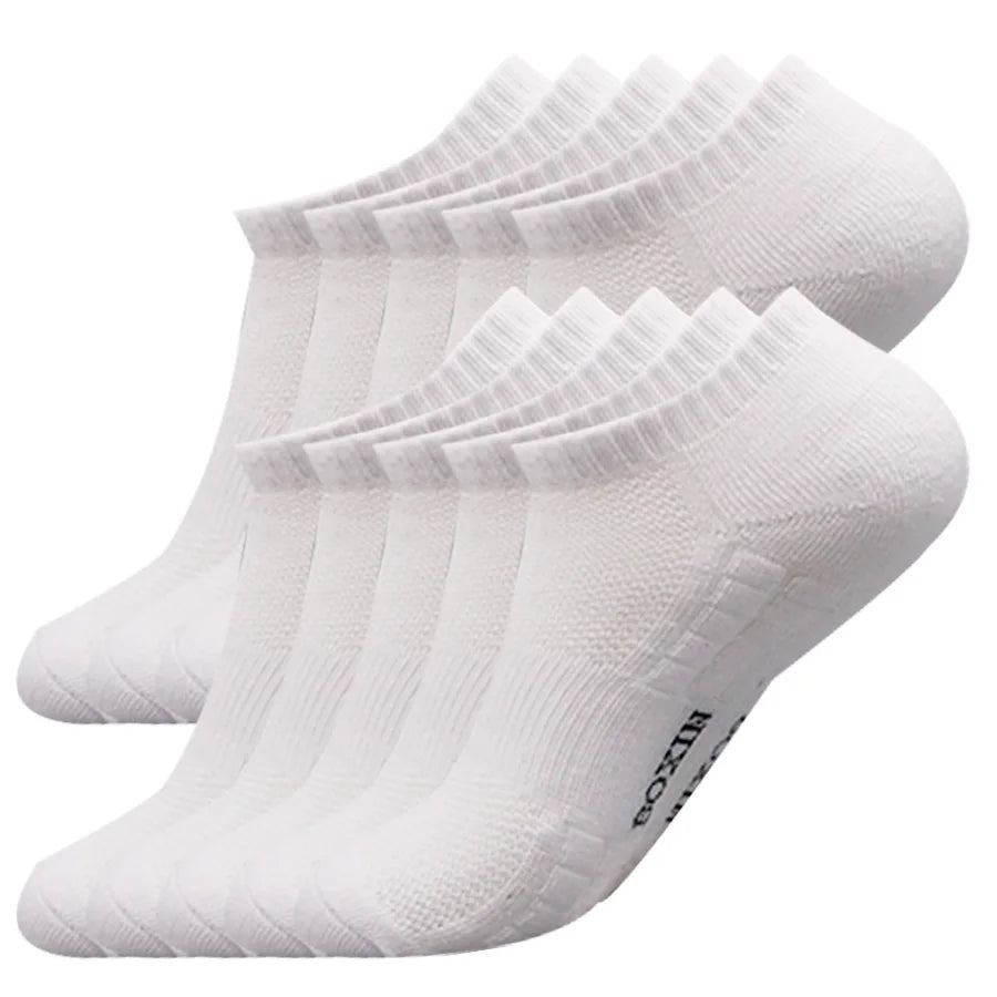 A stack of white men's essential warm socks for outdoor activities