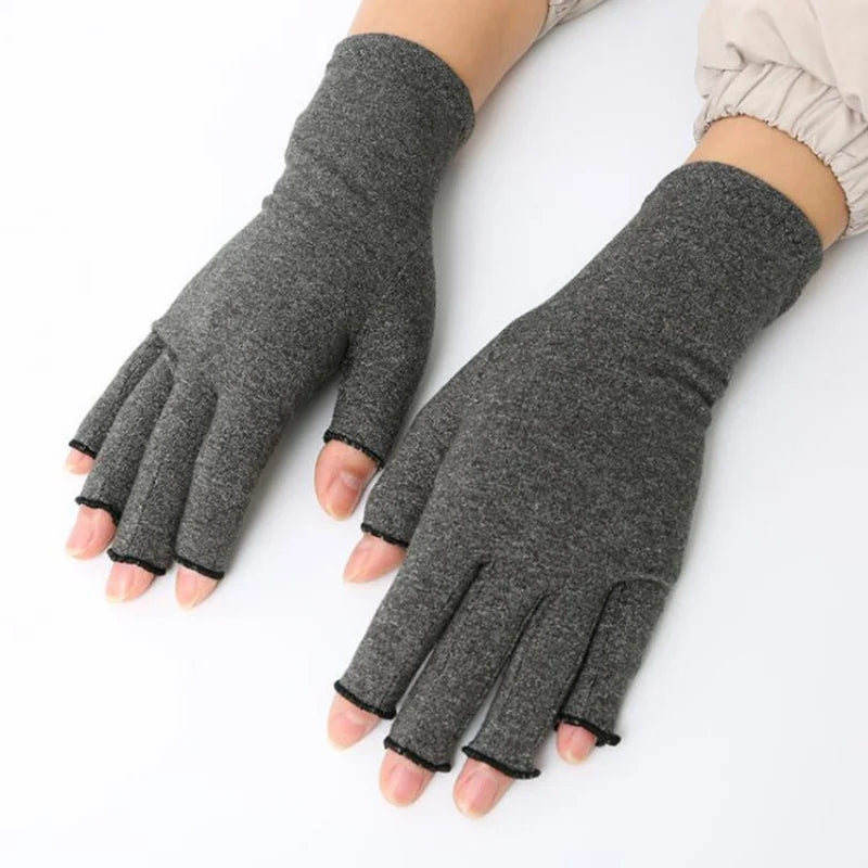A close-up of fingerless breathable gloves in a gray color being worn on a hand.