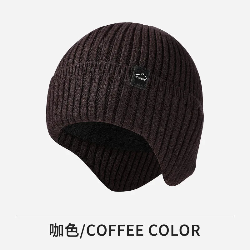 A dark brown knitted winter knit hat with a ribbed texture.