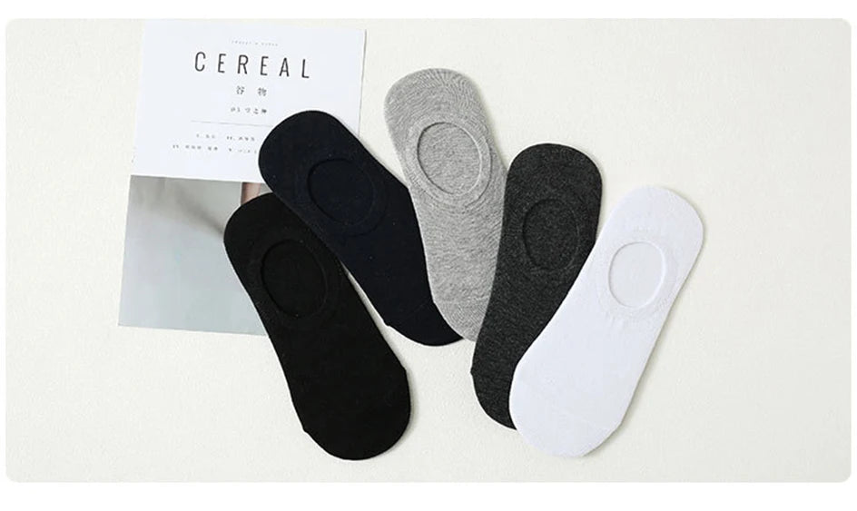 A collection of multi-colored breathable cotton ankle socks displayed next to a product box.