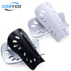White and black adjustable EVA soccer shin guards displayed on a white background.