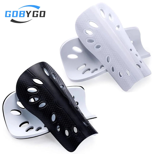 White and black adjustable EVA soccer shin guards displayed on a white background.