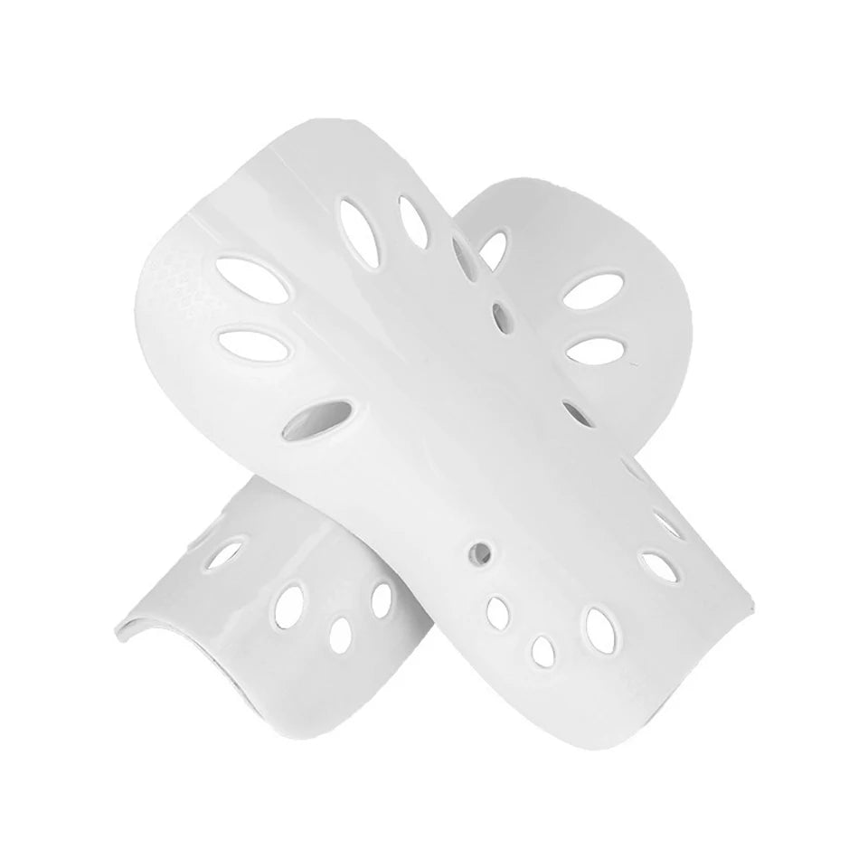 White adjustable EVA soccer shin guards shown from the side.