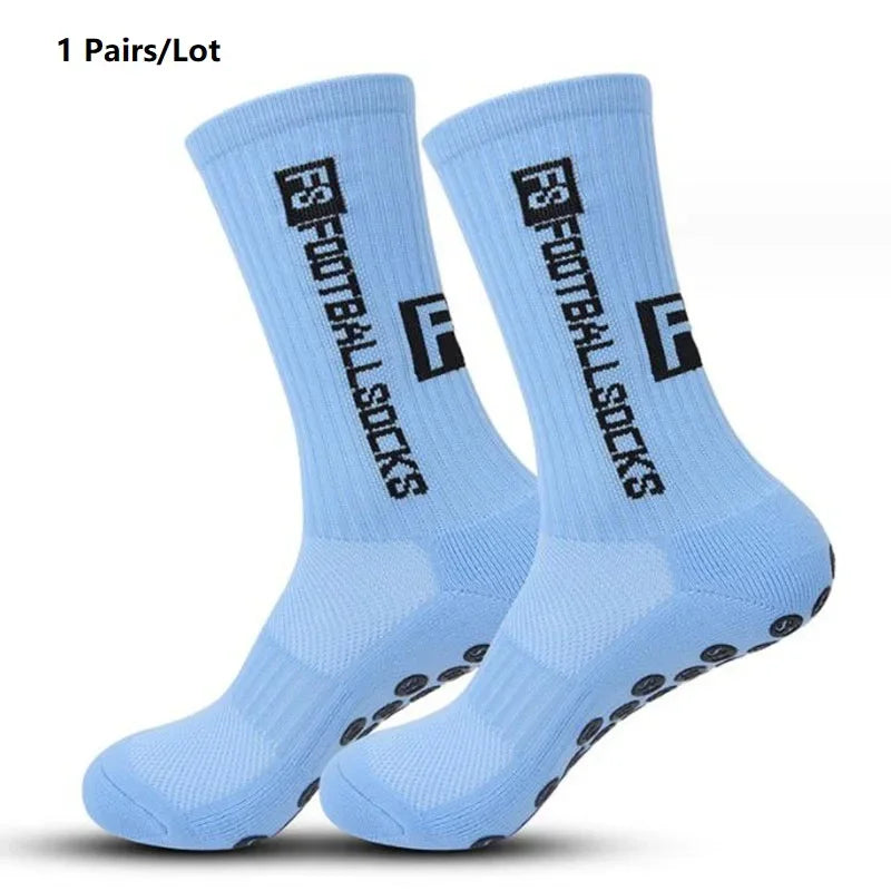 One pair of light blue anti-slip performance sports socks shown from the side.
