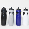 Four black and white water bottles with blue accents lined up against a white background.