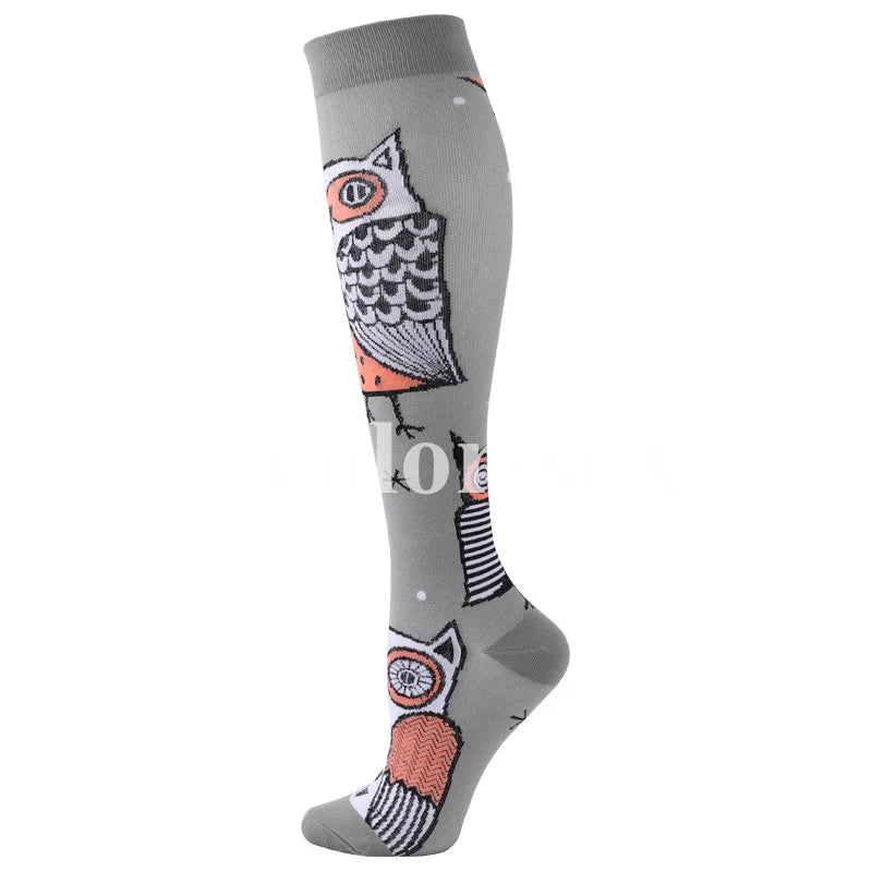 Gray compression socks featuring repeating owl designs in orange and black.
