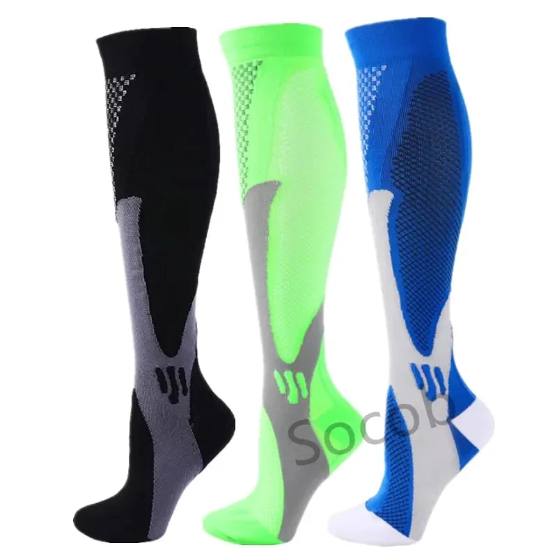 A set of three compression socks in black, neon green, and blue with gray accents.
