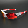 White and red wraparound sports sunglasses with UV400 lens protection resting on a dark surface.