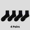 Four pairs of black breathable sports performance socks laid out flat.