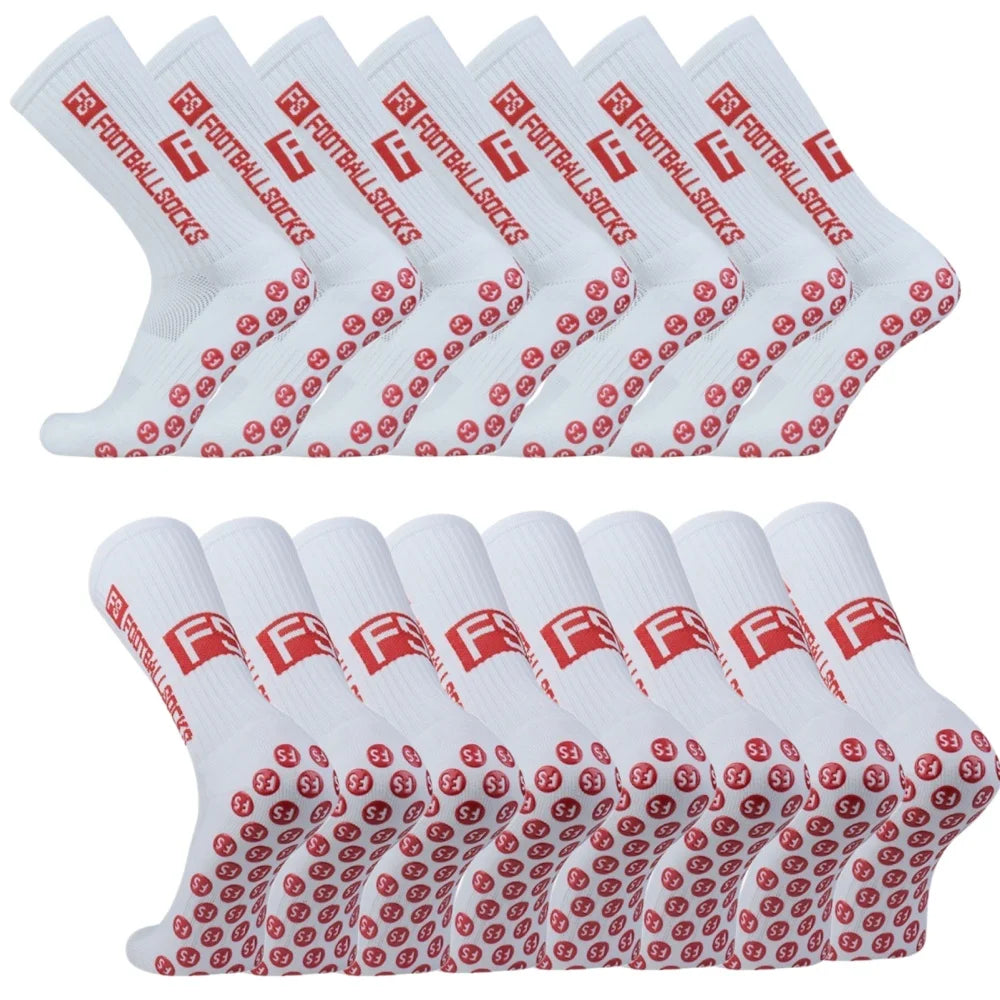 A pack of white non-slip grip socks with red and black logos, displayed in a row.