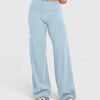 Light blue high waisted wide leg yoga pants worn by a person.