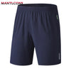 Navy blue men's quick dry jogging shorts shown flat lay