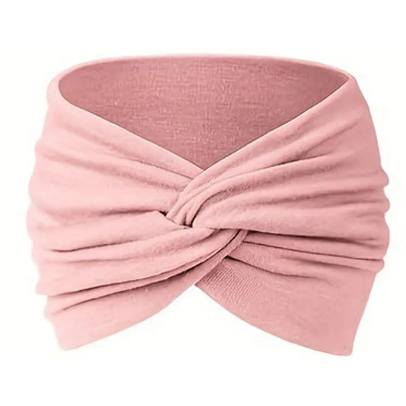 A pink stretch sport headband tied in a knot, shown from the side.