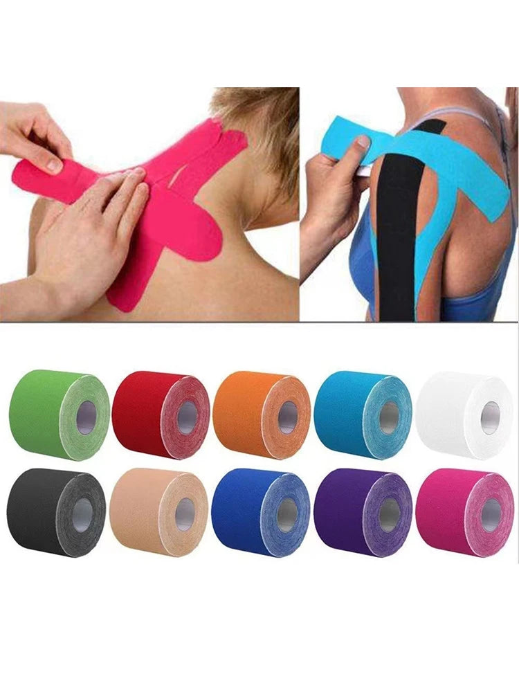 Various colors of kinesiology tape applied to a person's shoulder and arm for athletic recovery.