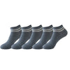 A row of grey non-slip grip socks for yoga and pilates