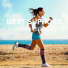 A woman running outdoors wearing compression socks while exercising.