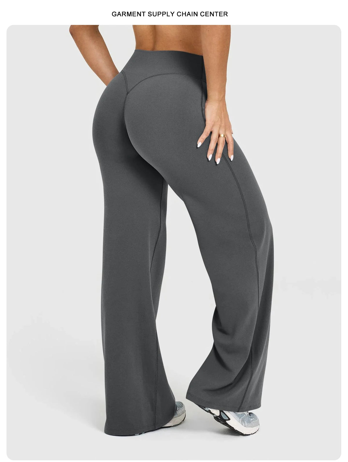 A model is wearing dark gray high waisted wide leg yoga pants.