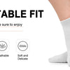 A close-up of a pair of white comfortable fit socks being worn on a foot.