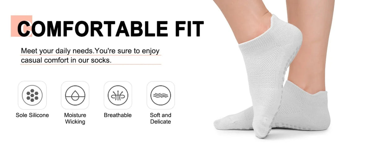 A close-up of a pair of white comfortable fit socks being worn on a foot.