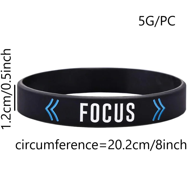 Black silicone wristband with FOCUS text and blue arrows, measuring 1.2cm thick and 20.2cm circumference.