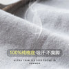 Close-up of light gray ultra-thin ice silk socks being displayed, showing a soft texture and steam.