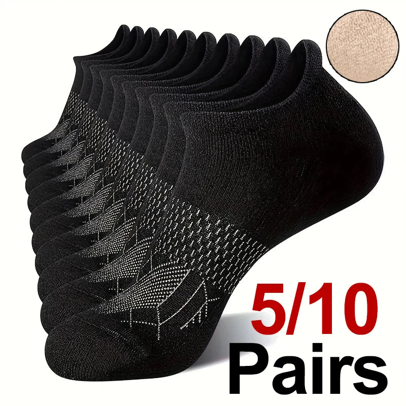 A stack of black performance compression ankle socks with a gold glitter swatch shown next to the product.