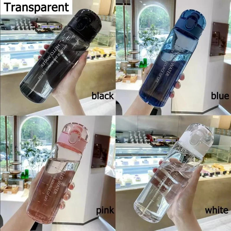 A collection of transparent sports water bottles in black, blue, pink, and white are shown being held by a hand.