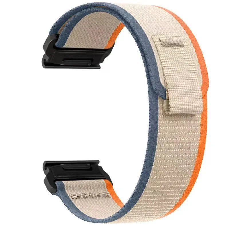 A beige and blue nylon strap for a sports watch, shown from the side.