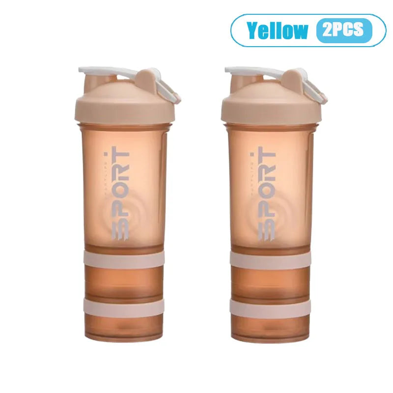 Two yellow 3-layer protein shaker bottles with handles shown side by side.