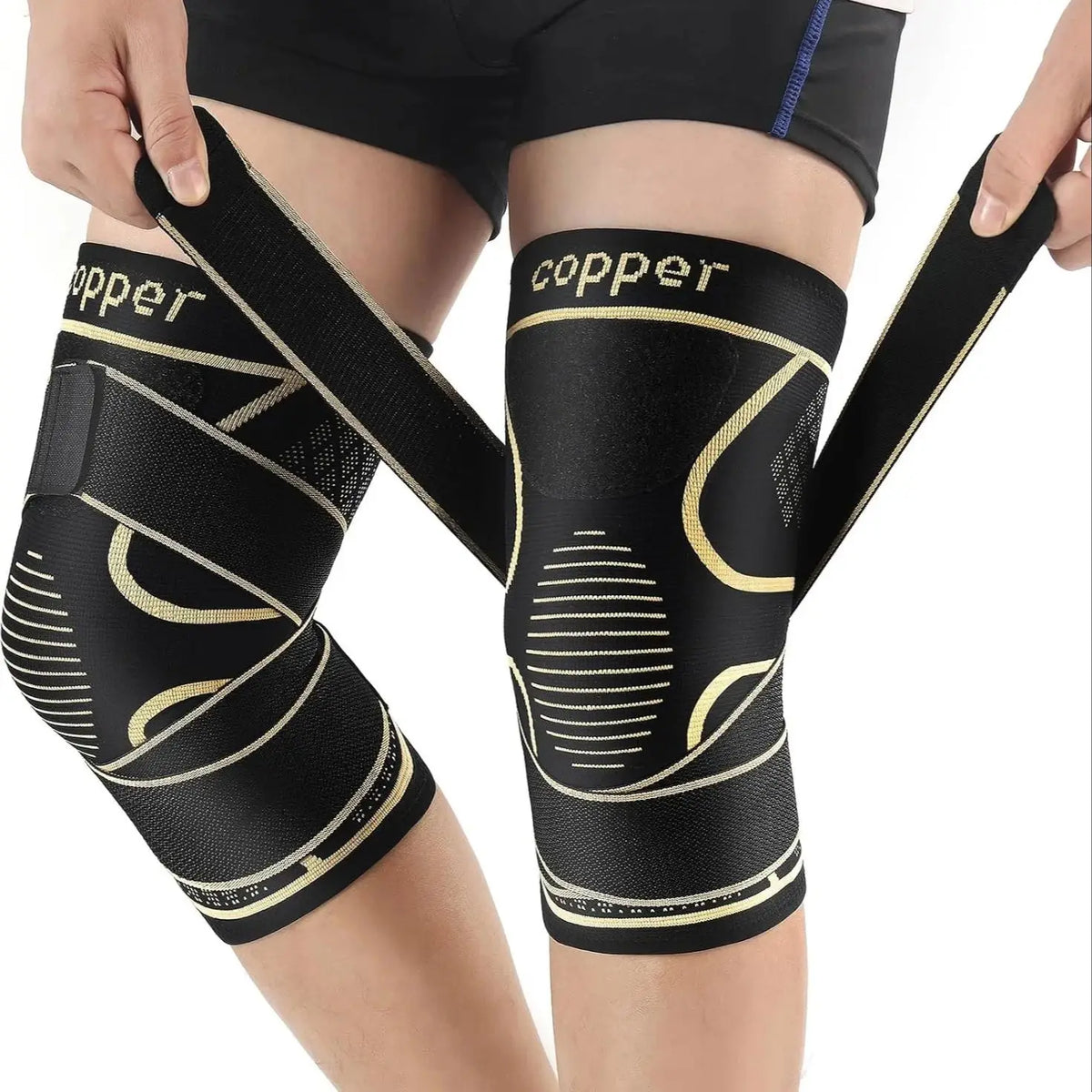 Black copper knee braces with straps worn on a person's leg.