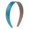 A curved satin hair band in teal blue and brown is shown against a white background.