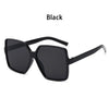 Black vintage oversized retro sunglasses with black frames and lenses