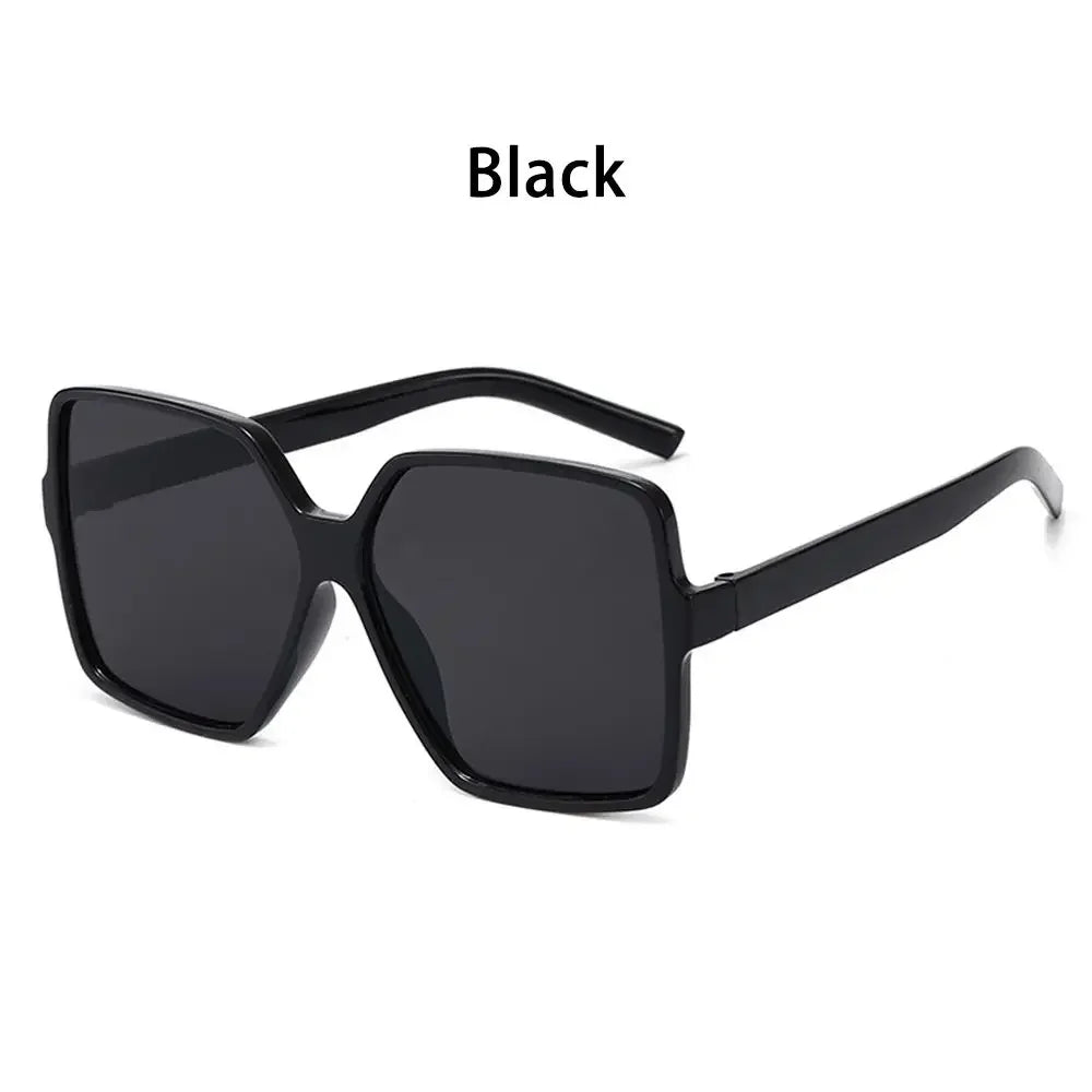 Black vintage oversized retro sunglasses with black frames and lenses