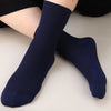 Navy blue bamboo fibre anti-odor socks worn on a person's foot.