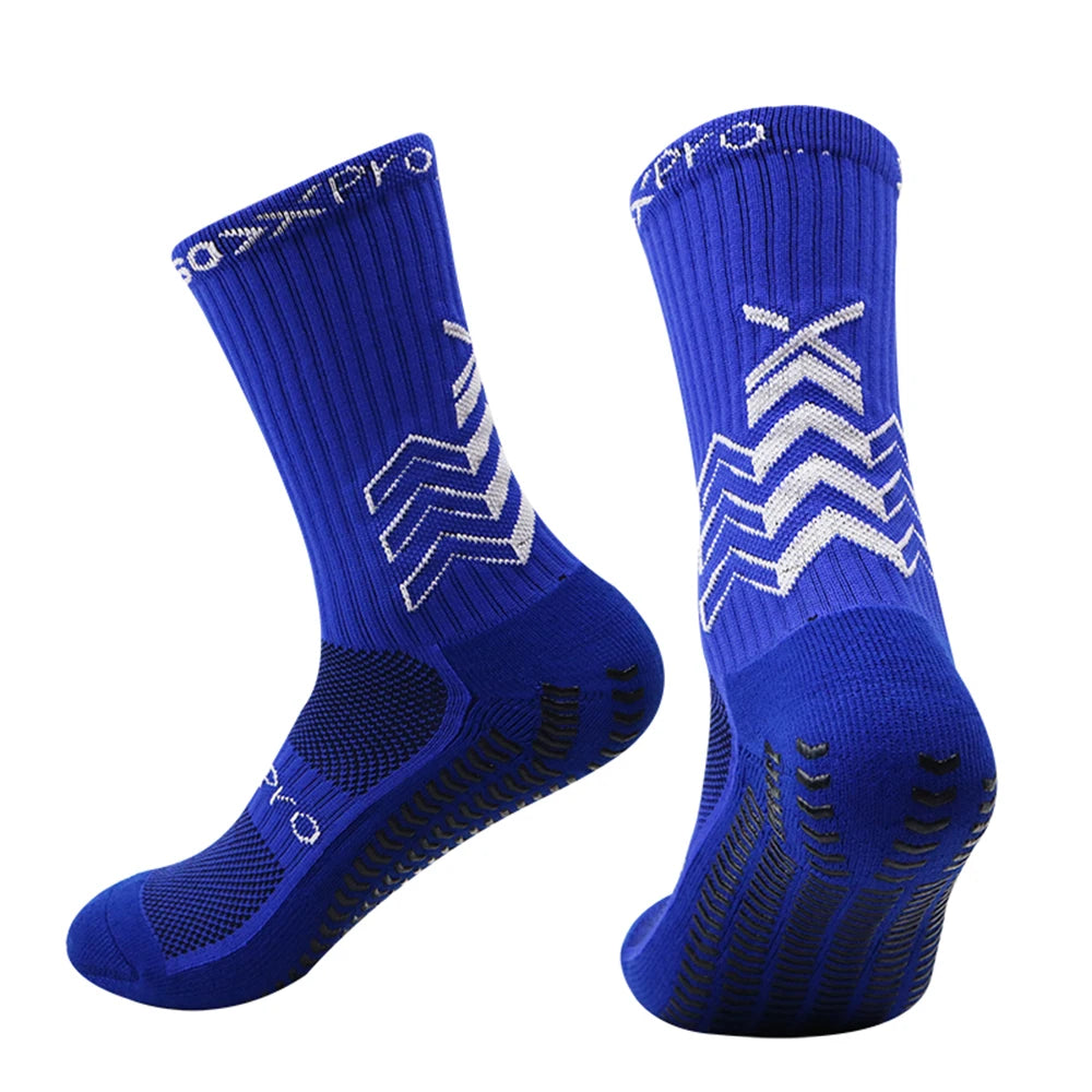 A pair of royal blue athletic sports socks with a textured knit and white chevron patterns.