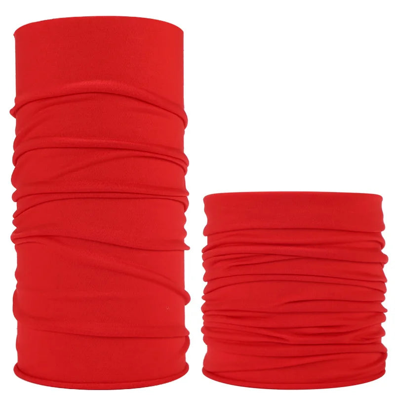 A stack of red seamless fabric headbands and balaclavas rolled up.