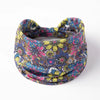 A colorful floral butterfly patterned fabric headband worn around the head.