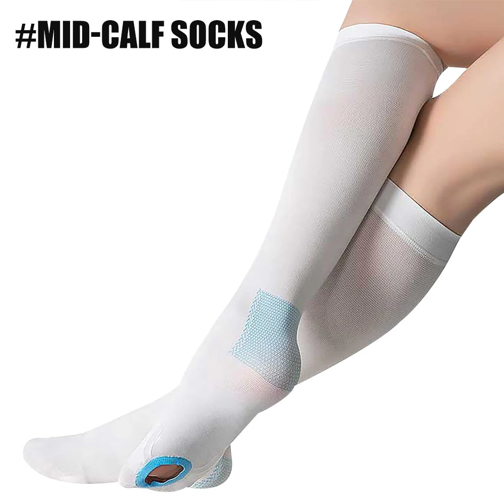 A close-up of white mid-calf compression socks being worn on a leg.
