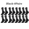 Eight pairs of black multi-sport athletic grip socks laid out in a row.