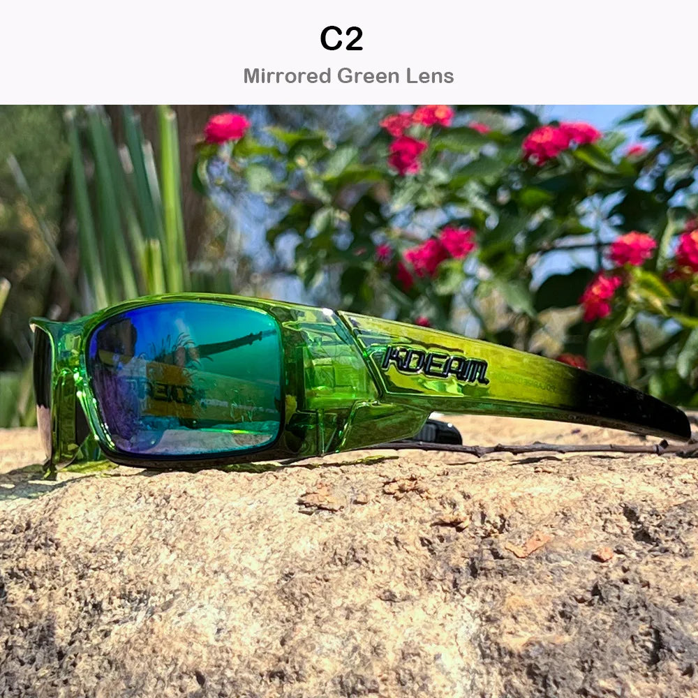 A pair of mirrored green polarized sports sunglasses resting on a rough, light-colored rock outdoors.