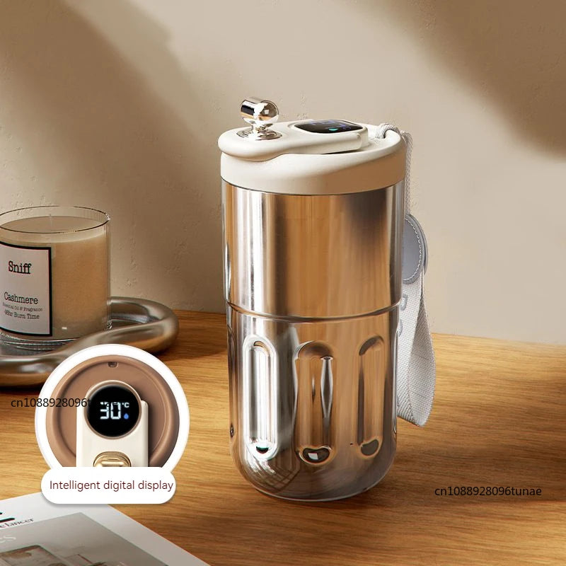 A stainless steel thermo mug with an intelligent digital display and lid is shown on a wooden surface.