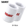 Pair of white and red athletic wristbands for sport or activewear