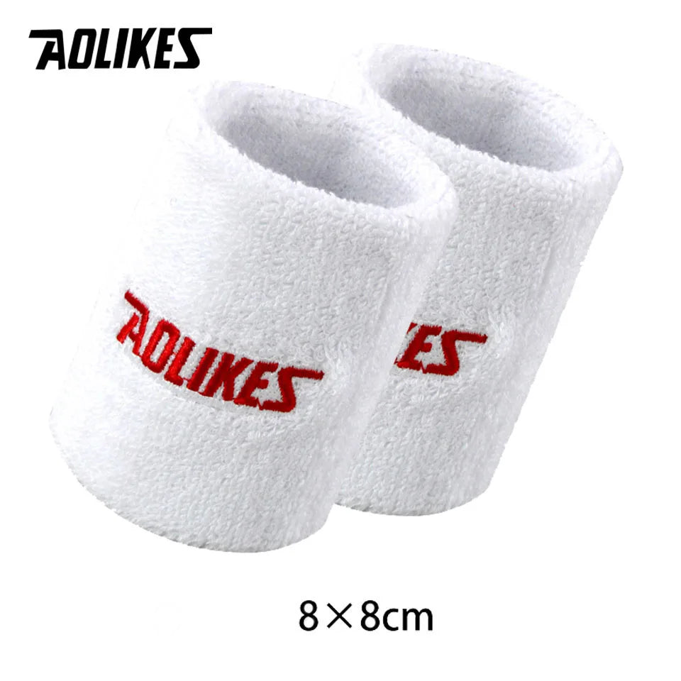 Pair of white and red athletic wristbands for sport or activewear
