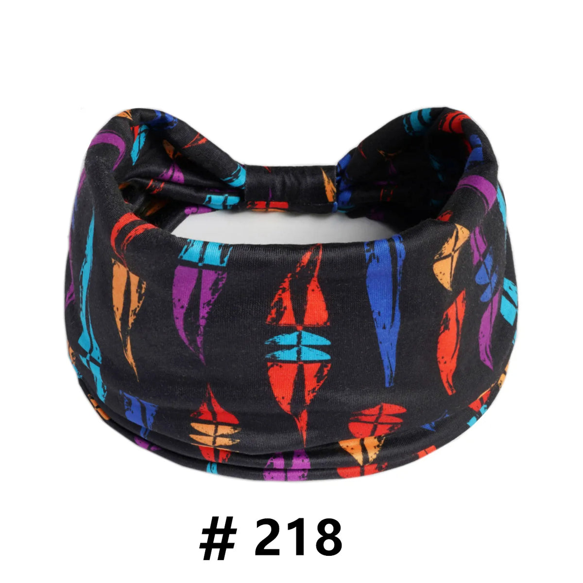 A black fabric turban headband with colorful abstract patterns