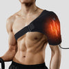 A man wearing a black electric heating wrap on his shoulder, demonstrating the device for pain relief.