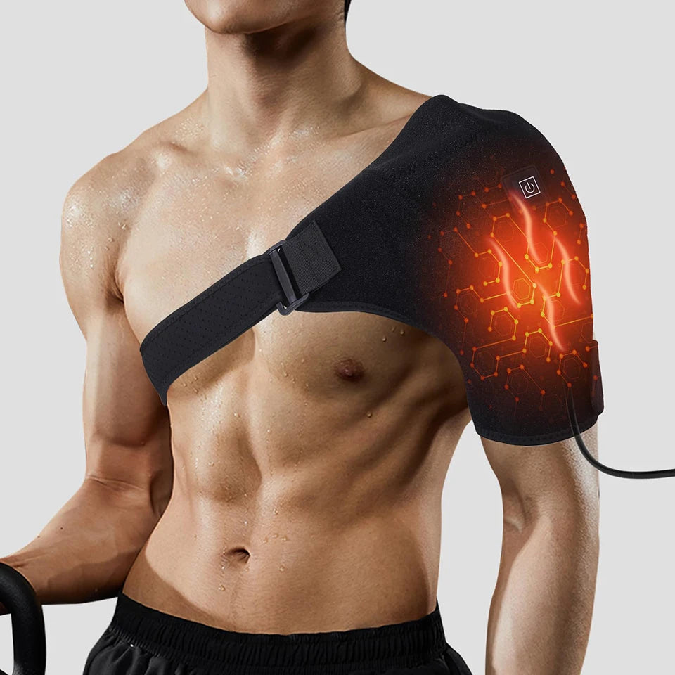 A man wearing a black electric heating wrap on his shoulder, demonstrating the device for pain relief.
