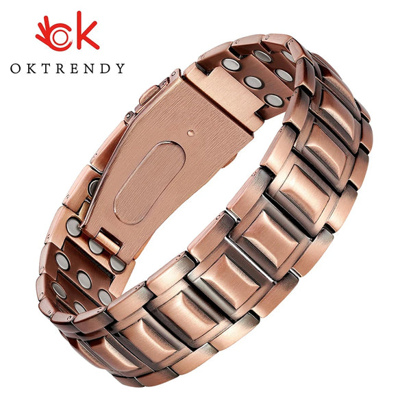 A close-up view of a rose gold copper bracelet with a textured metal band and a rectangular buckle.